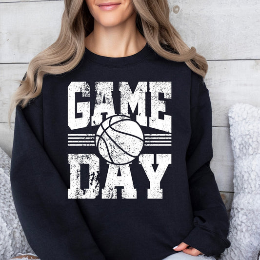 Person wearing a black sweatshirt with 'Game Day' and a basketball graphic.