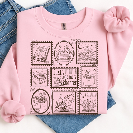 Pink sweatshirt with book-themed graphics on a white background