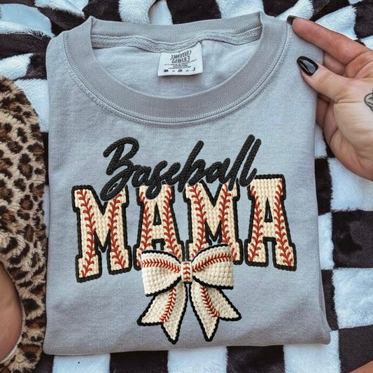 Gray sweatshirt with 'Baseball Mama' text and bow design held by a person.