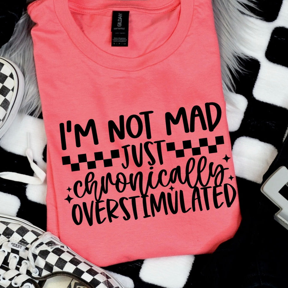 Pink tank top with text on a checkered surface