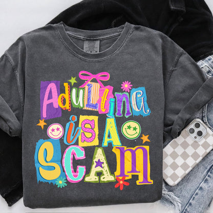 adulting is a scam clear film screen print