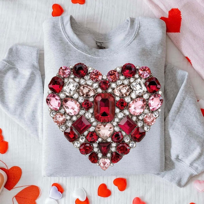 Gray sweatshirt with a large, ornate heart-shaped gemstone design on a white background with red heart shapes.