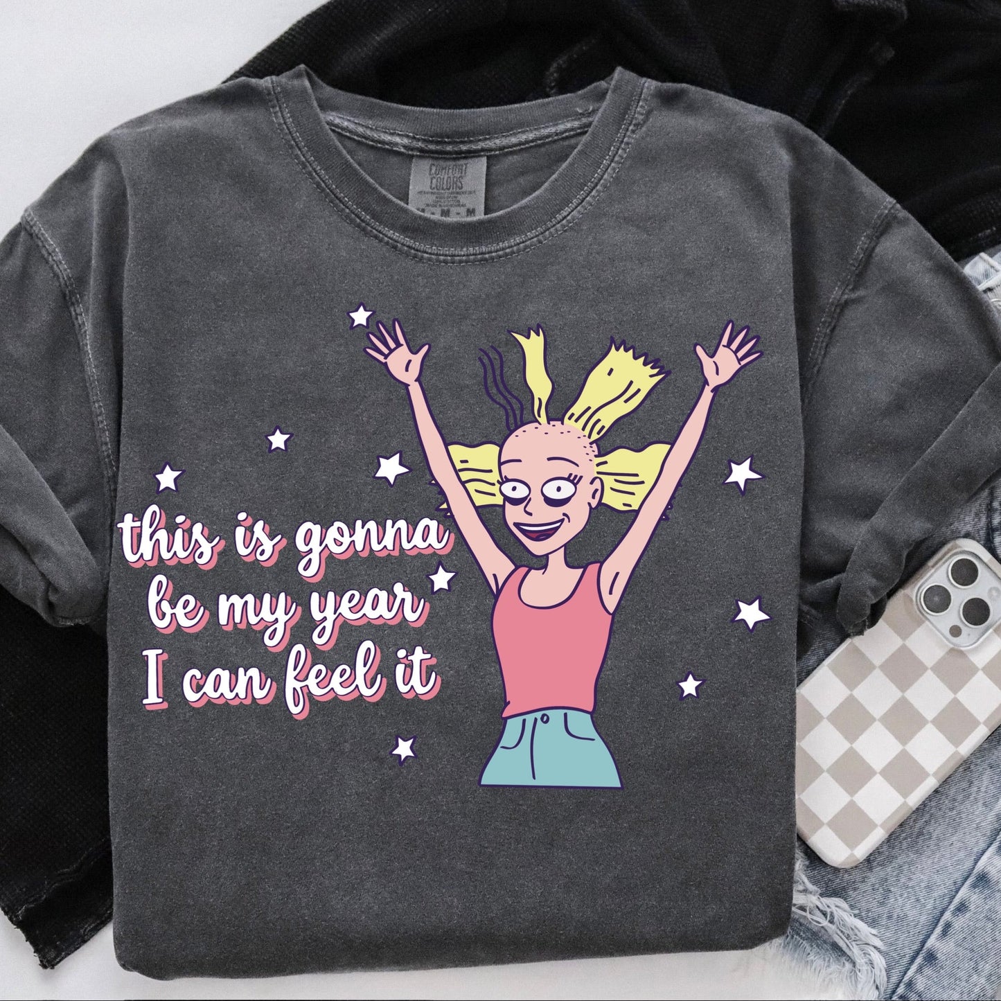 Gray sweatshirt with a cartoon character and text 'this is gonna be my year I can feel it' on a white background.