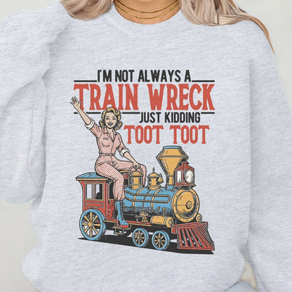 Person wearing a light gray sweatshirt with a train graphic and text.