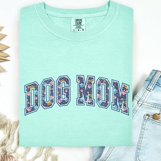Mint green t-shirt with 'DOG MOM' print on a white background
