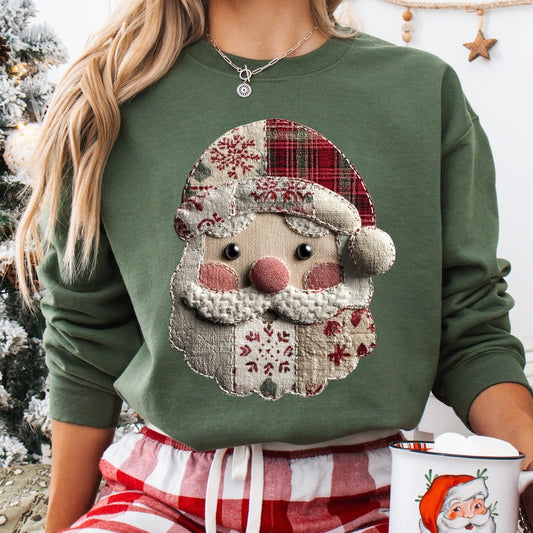 Person wearing a green sweater with a Santa Claus design, holding a mug, in a festive setting.