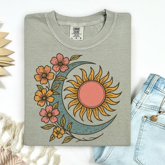 Gray sweatshirt with sun and moon design on a white background