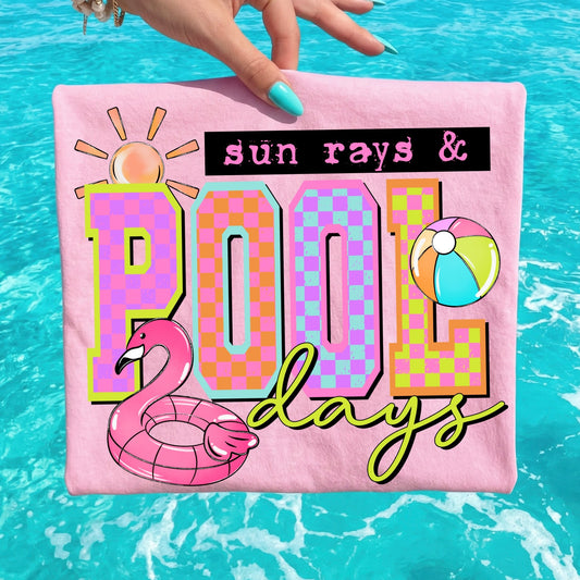Pink pillow with 'sun rays & pool days' text and pool float graphics against a blue water background
