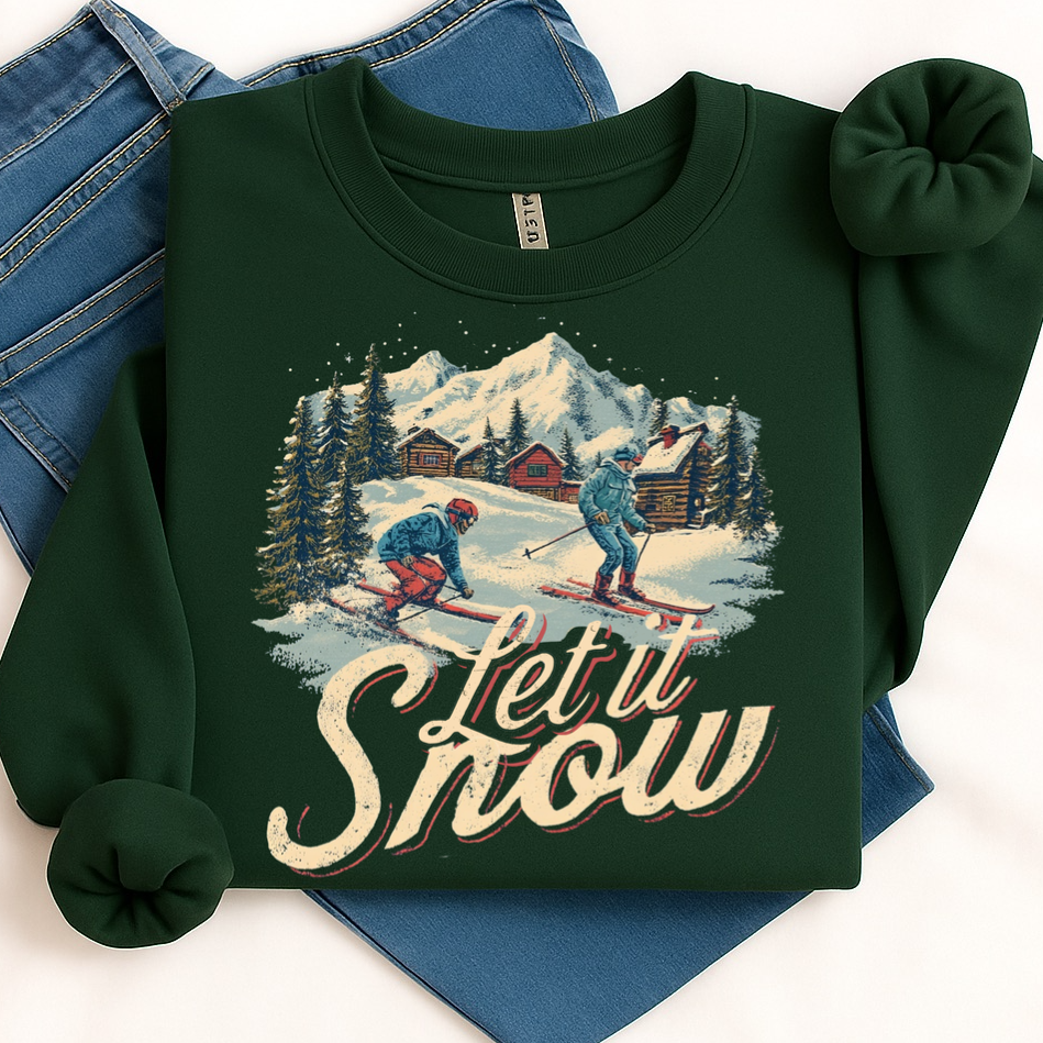 Green sweatshirt with skiing design and 'Let it Snow' text on a white background