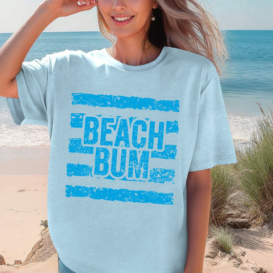 Woman wearing a 'Beach Bum' t-shirt on a beach