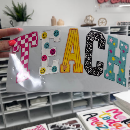 hand painted TEACH clear film screen print
