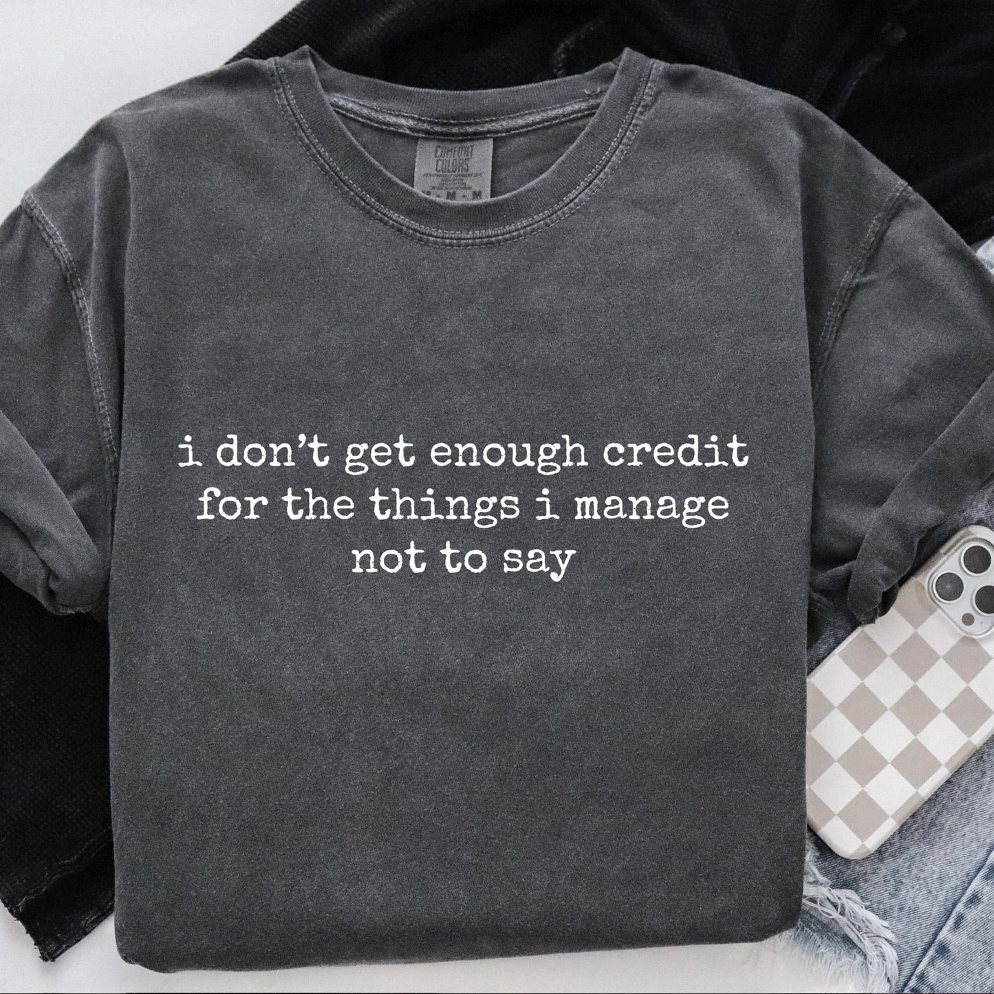 Dark gray sweatshirt with text on a white background